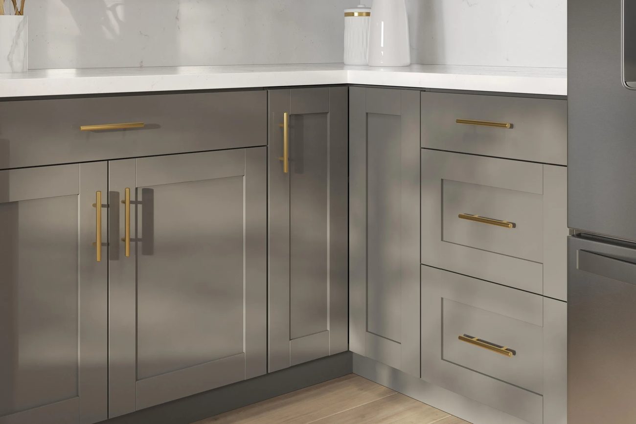 Close-up of slate shaker cabinet fronts with brass pulls