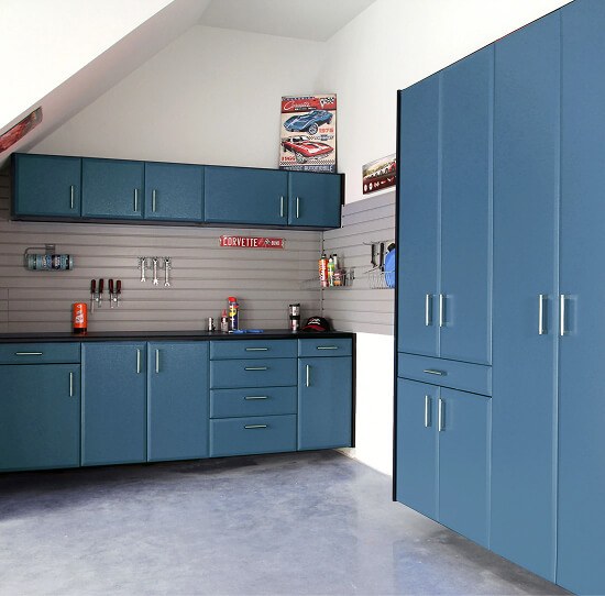 Powder-coated garage cabinetry with slatwall and full-height storage towers
